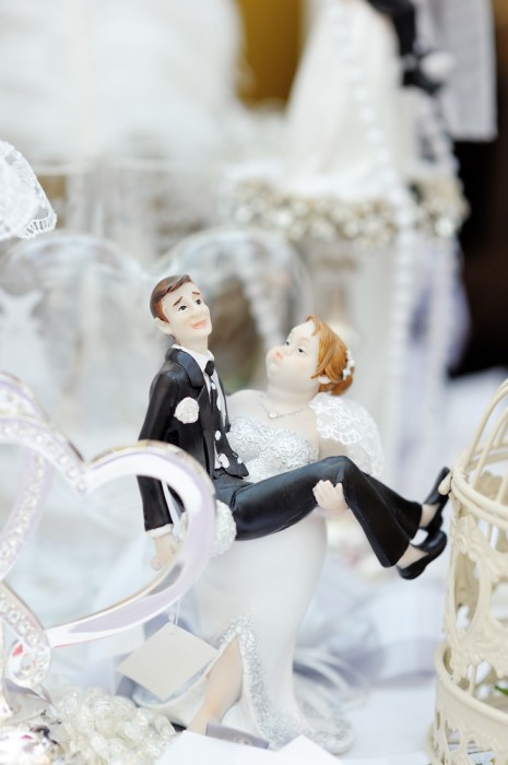 Funny figurines on top of wedding cake
