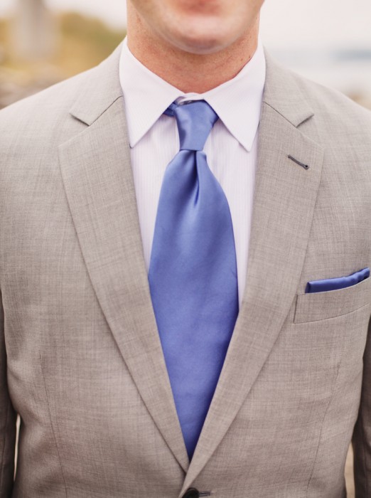 Groom in grey suit with blue tie