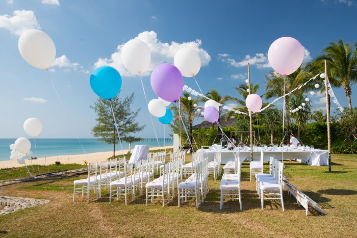 Wedding set up in the white theme decorated with the colorful balloon