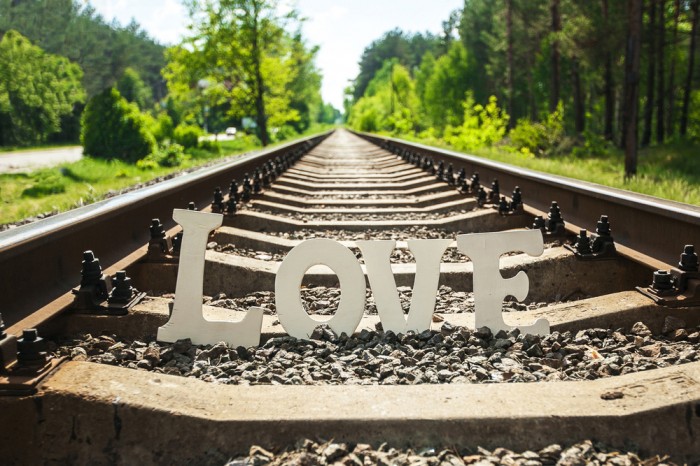 White letters love on railway