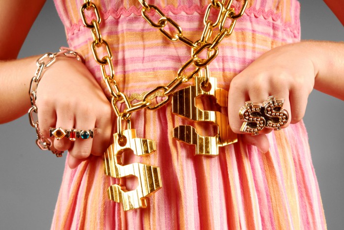 Young girl wearing hip hop jewelry