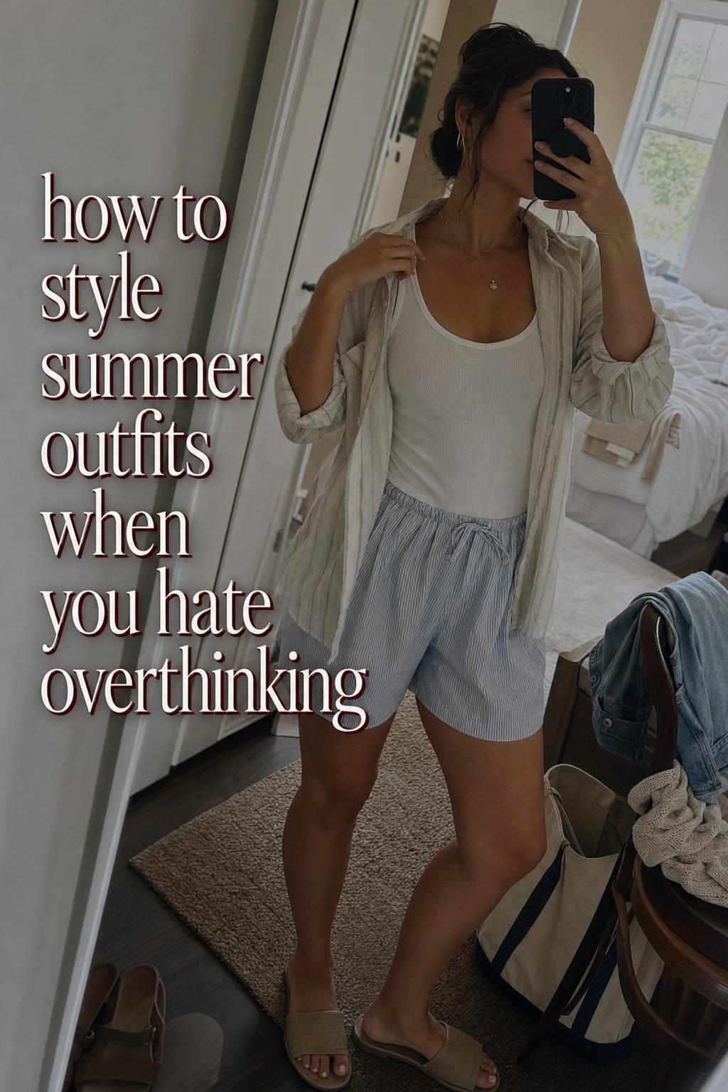 Mirror selfie showing how to style summer outfits with linen shirt, tank and shorts in a casual slightly messy bedroom