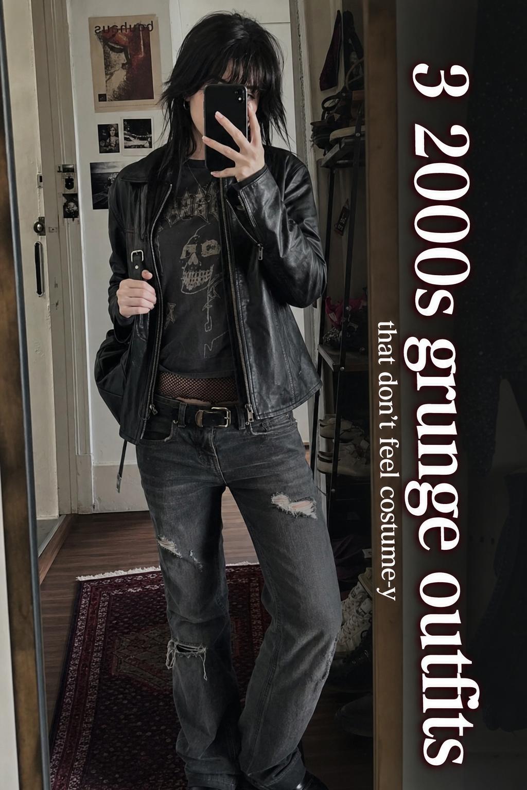 Mirror selfie in a cluttered apartment showing 2000s grunge outfits with band tee, flannel, low-rise jeans and combat boots
