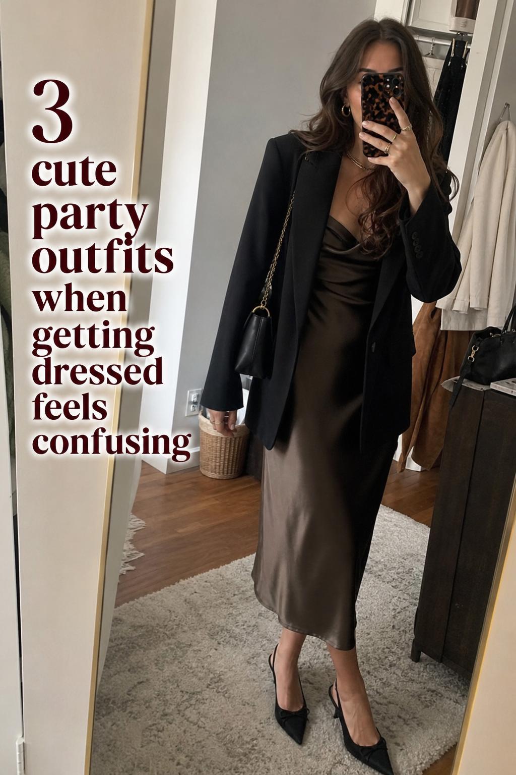 Cute party outfits mirror selfie in a lived-in apartment hallway, woman in satin midi dress with blazer and ankle boots
