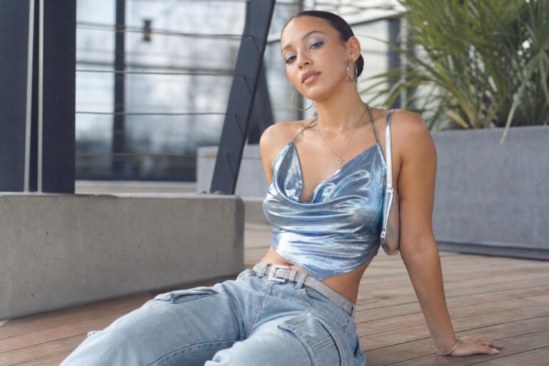 y2k outfits aesthetic with halter top, low-rise jeans, and metallic mini styled for day to night city streetwear