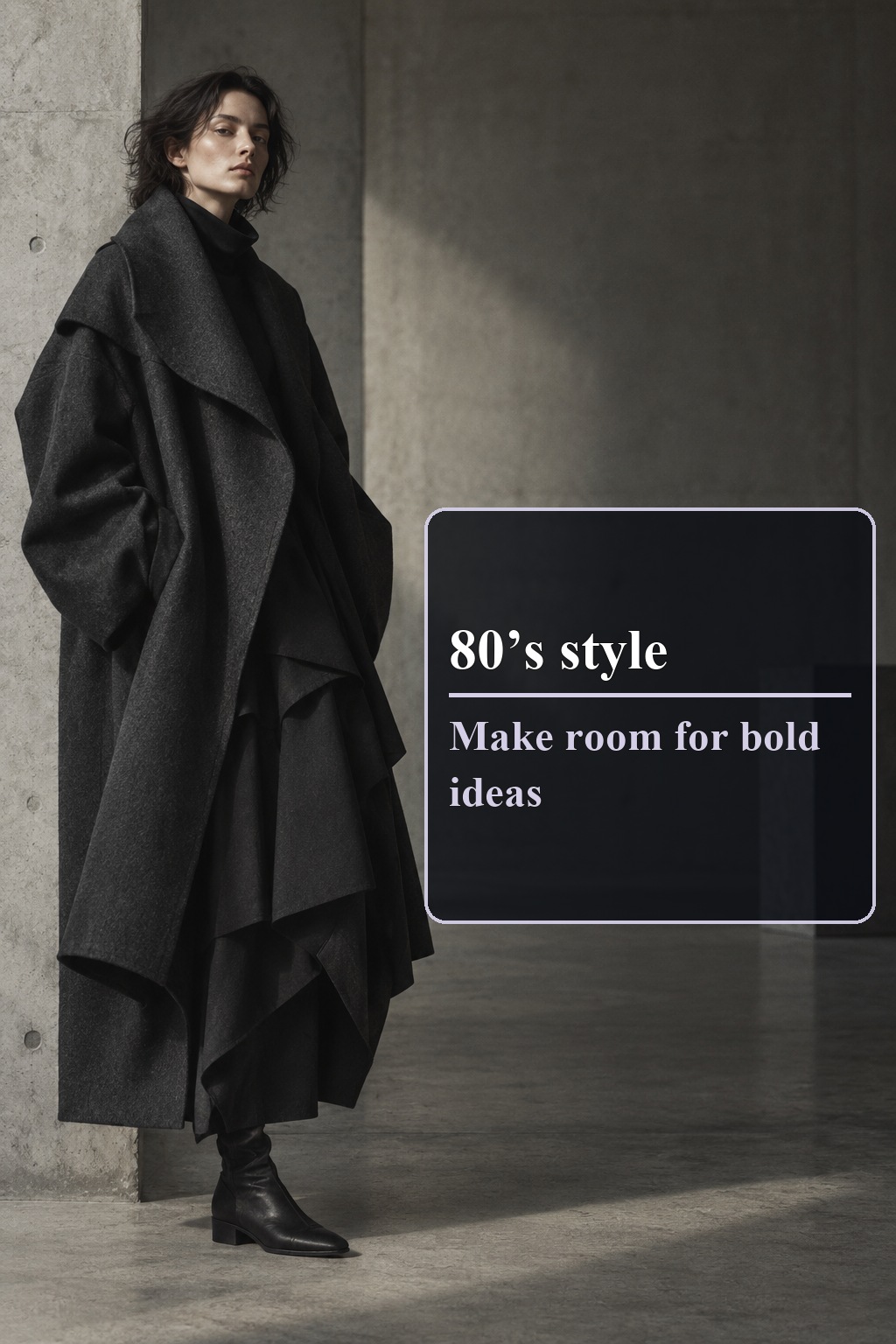 80’s style experimental fashion in a sculptural charcoal layered coat